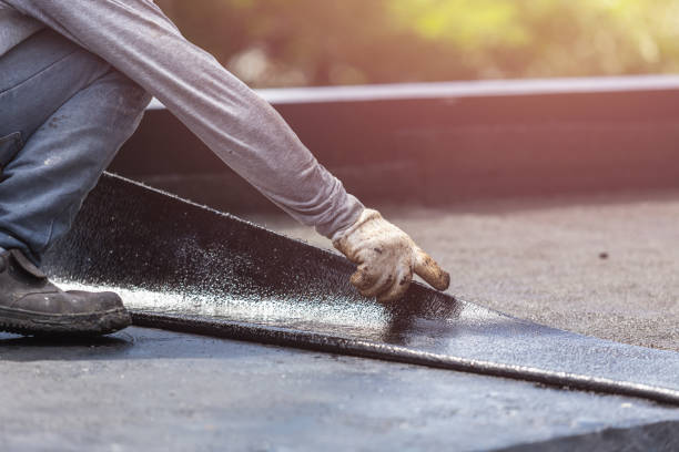 Professional Basement Waterproofing technician working in Hebron, MD